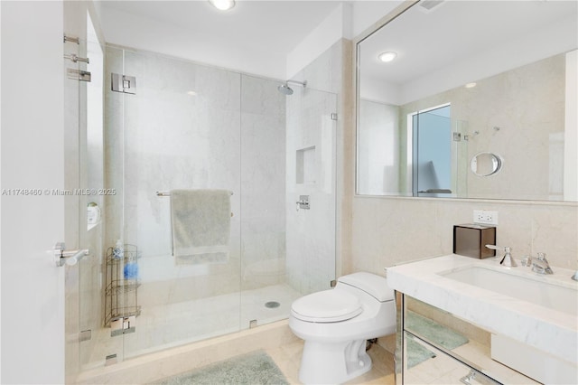 full bath featuring toilet, a shower stall, tile walls, and vanity