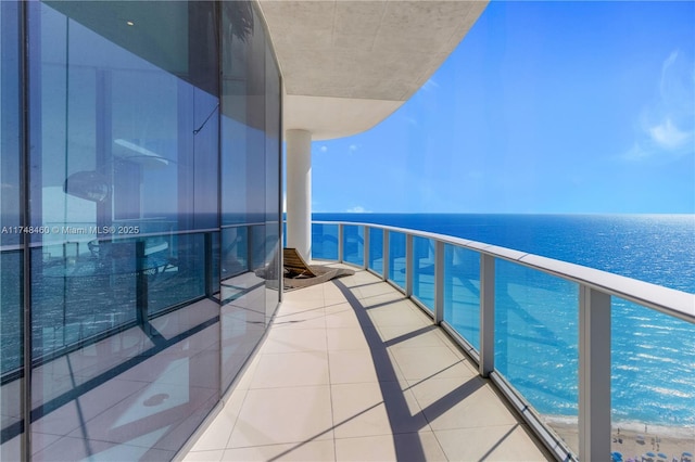 balcony featuring a water view