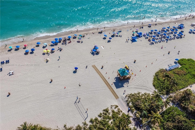 bird's eye view featuring a beach view and a water view