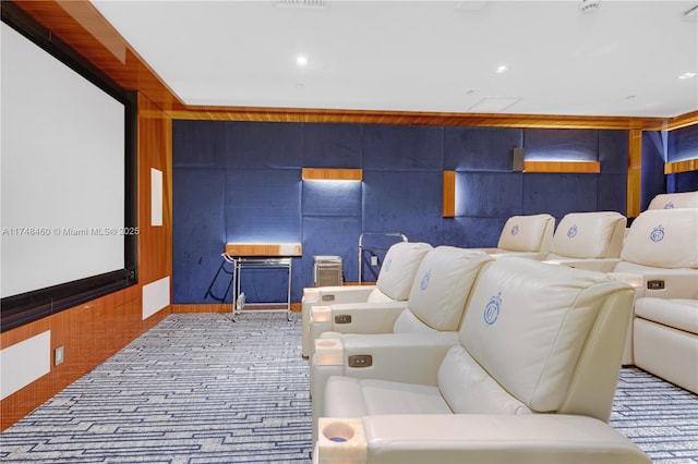 home theater featuring recessed lighting and wooden walls