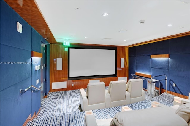 cinema featuring carpet floors, recessed lighting, and wooden walls