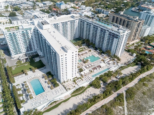 birds eye view of property with a view of city