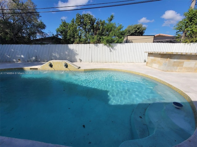 view of swimming pool with a fenced backyard and a fenced in pool