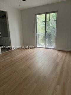 empty room featuring wood finished floors and a ceiling fan