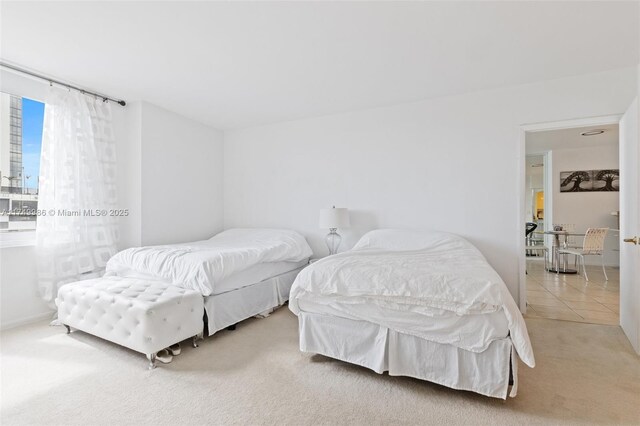 2301 Collins Ave Unit 504, Miami Beach, FL 33139 - carpeted bedroom with tile patterned floors