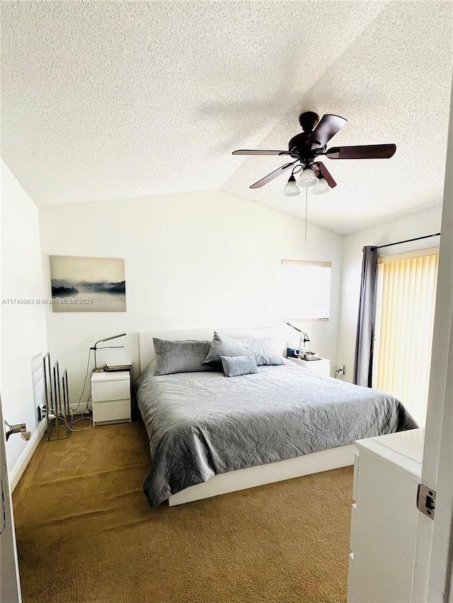 carpeted bedroom featuring lofted ceiling, ceiling fan, and a textured ceiling