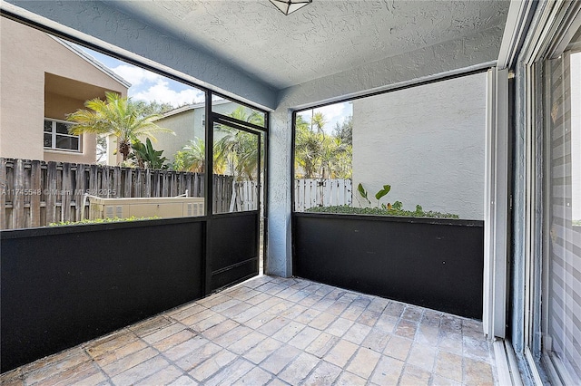 unfurnished sunroom with plenty of natural light