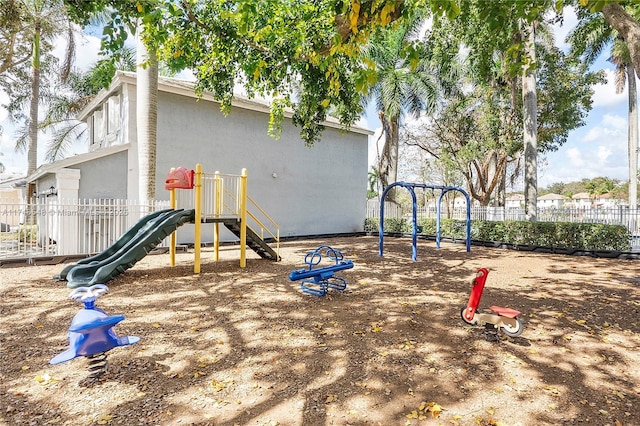 communal playground featuring fence