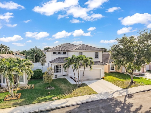 view of front of property with a garage, a tile roof, driveway, stucco siding, and a front yard