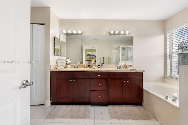 full bath featuring double vanity, a stall shower, a sink, and a bath