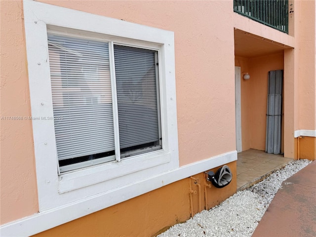 exterior details with visible vents and stucco siding