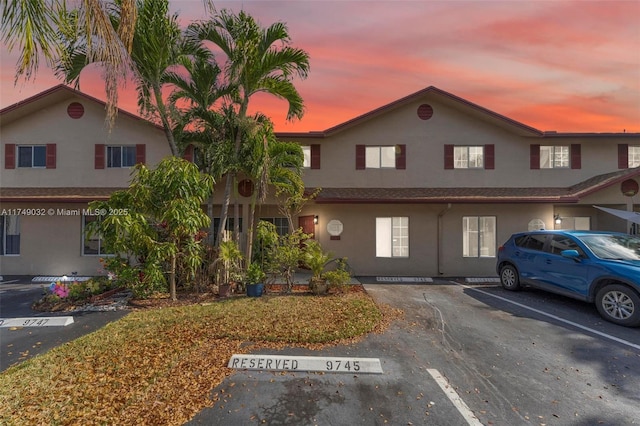 9745 NW 37th St Unit 9745, Sunrise, FL 33351 - view of front facade featuring uncovered parking and stucco siding