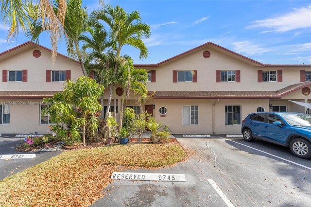 9745 NW 37th St Unit 9745, Sunrise, FL 33351 - multi unit property with stucco siding and uncovered parking
