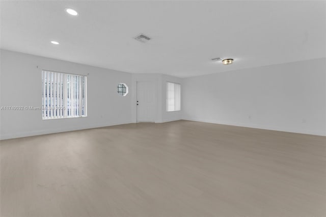 9745 NW 37th St Unit 9745, Sunrise, FL 33351 - empty room featuring visible vents, recessed lighting, light wood-style flooring, and baseboards