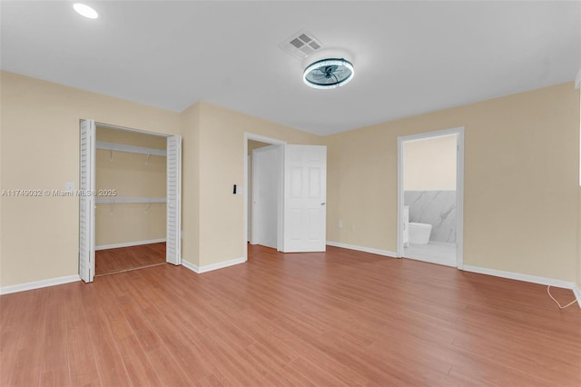 9745 NW 37th St Unit 9745, Sunrise, FL 33351 - unfurnished bedroom featuring baseboards, light wood-type flooring, and visible vents