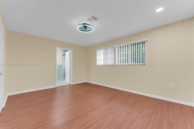 9745 NW 37th St Unit 9745, Sunrise, FL 33351 - unfurnished room with recessed lighting, baseboards, visible vents, and wood finished floors