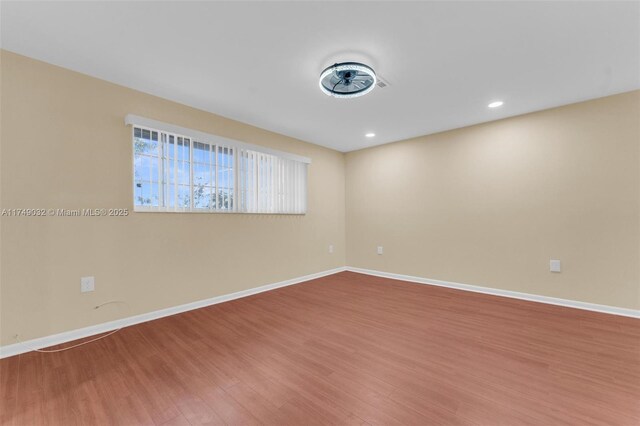 9745 NW 37th St Unit 9745, Sunrise, FL 33351 - empty room featuring recessed lighting, baseboards, and wood finished floors