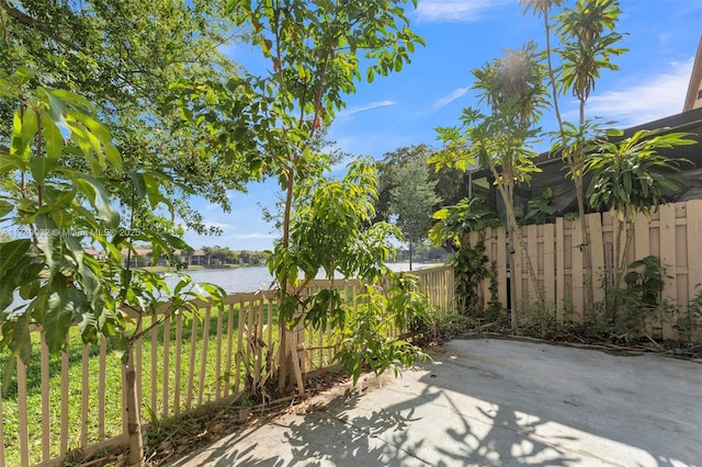 9745 NW 37th St Unit 9745, Sunrise, FL 33351 - view of patio featuring a water view and fence