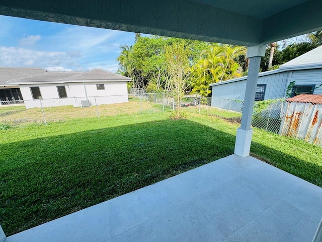 view of yard featuring a patio area and a fenced backyard