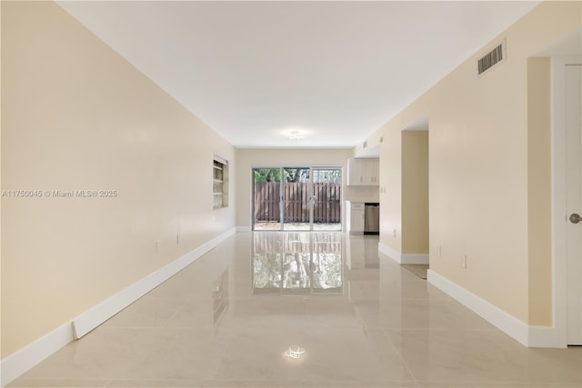 interior space with visible vents and baseboards