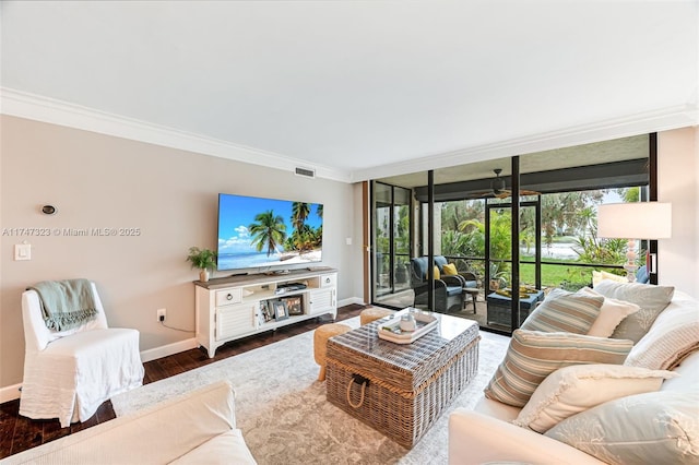 living room with expansive windows, baseboards, dark wood finished floors, and crown molding