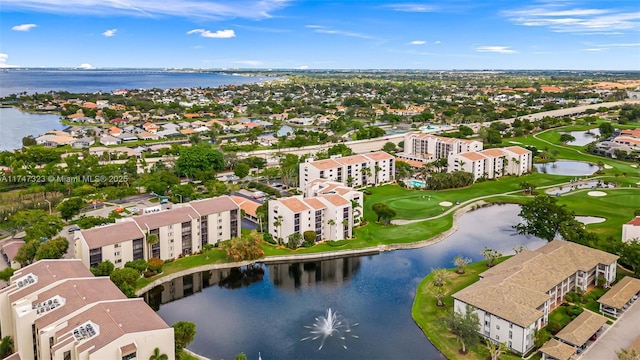 aerial view featuring a water view and golf course view