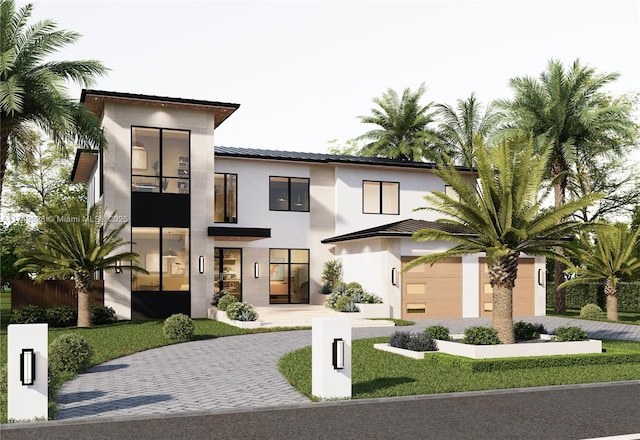 702 NW 5th Ave, Delray Beach, FL 33444 - modern home featuring decorative driveway and stucco siding