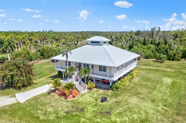 drone / aerial view with a view of trees