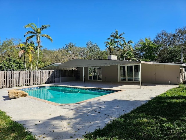 view of pool with a patio area, fence, and a fenced in pool