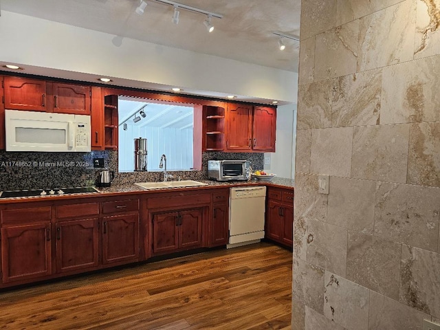 kitchen featuring dark wood-style floors, open shelves, decorative backsplash, a sink, and white appliances