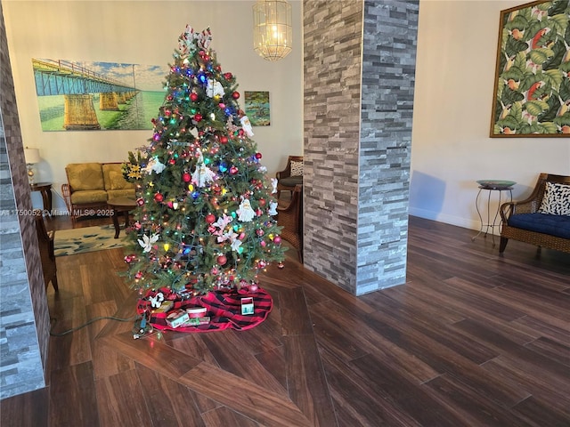 1505 N Riverside Dr Unit 604, Pompano Beach, FL 33062 - detailed view of baseboards, wood finished floors, and a chandelier