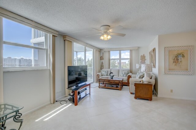 1505 N Riverside Dr Unit 604, Pompano Beach, FL 33062 - living area featuring ceiling fan, a textured ceiling, and baseboards