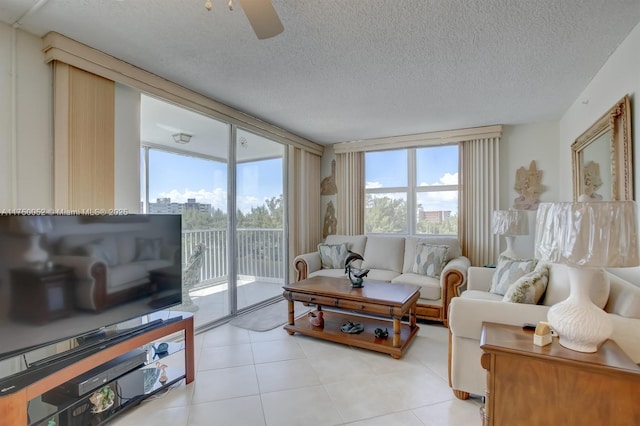 1505 N Riverside Dr Unit 604, Pompano Beach, FL 33062 - living area with ceiling fan, a textured ceiling, and light tile patterned flooring