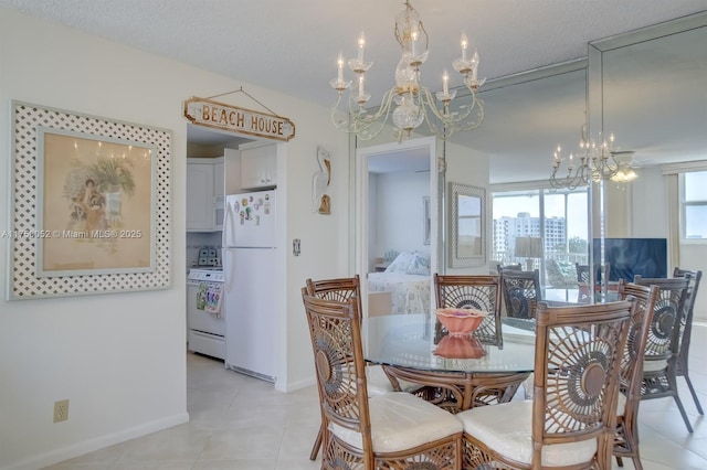 1505 N Riverside Dr Unit 604, Pompano Beach, FL 33062 - dining room with a chandelier, baseboards, and light tile patterned floors