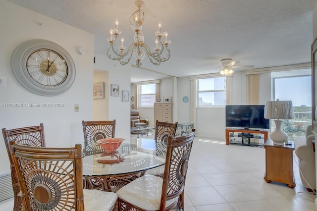 1505 N Riverside Dr Unit 604, Pompano Beach, FL 33062 - dining room featuring a ceiling fan, a chandelier, a textured ceiling, and light tile patterned floors