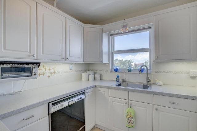 1505 N Riverside Dr Unit 604, Pompano Beach, FL 33062 - kitchen with dishwasher, a sink, backsplash, and white cabinetry