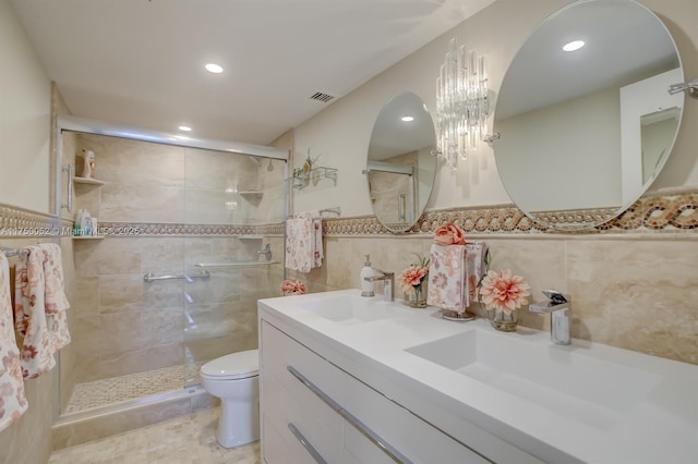 1505 N Riverside Dr Unit 604, Pompano Beach, FL 33062 - full bathroom with toilet, a shower stall, tile walls, double vanity, and recessed lighting