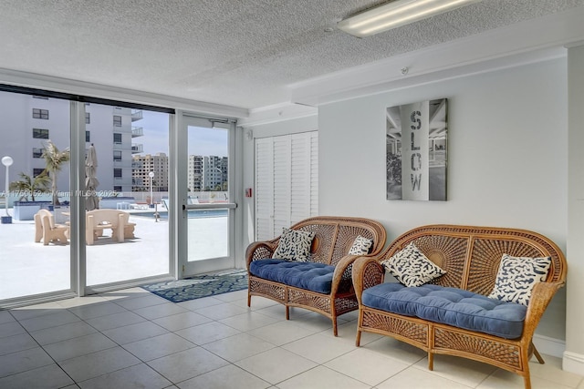 1505 N Riverside Dr Unit 604, Pompano Beach, FL 33062 - living area featuring a textured ceiling, tile patterned floors, and a view of city