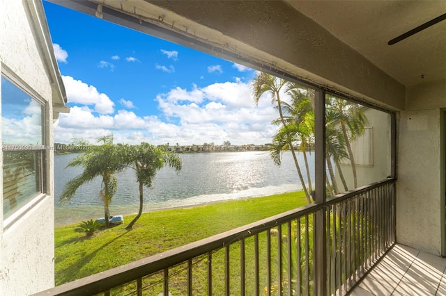 balcony featuring a water view