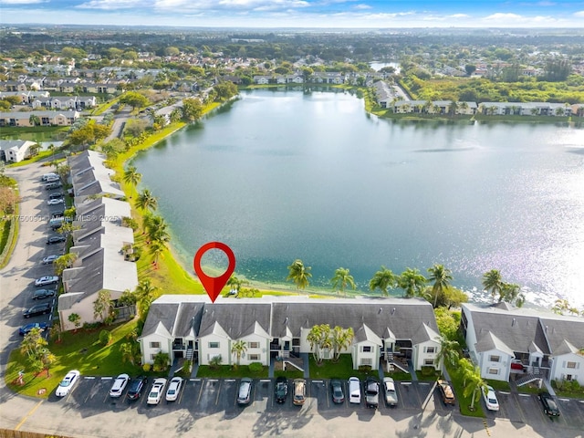 bird's eye view with a water view and a residential view