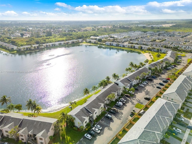 birds eye view of property featuring a water view and a residential view