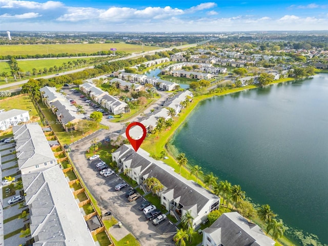 bird's eye view with a water view and a residential view