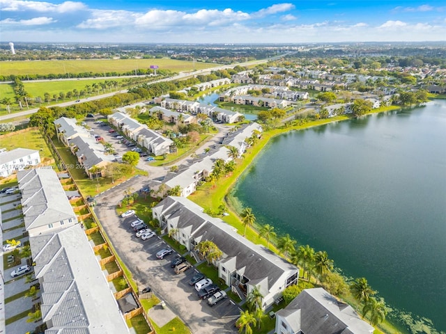 birds eye view of property with a residential view and a water view