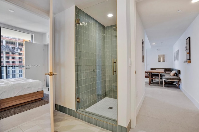 full bathroom with ensuite bathroom, a stall shower, and recessed lighting