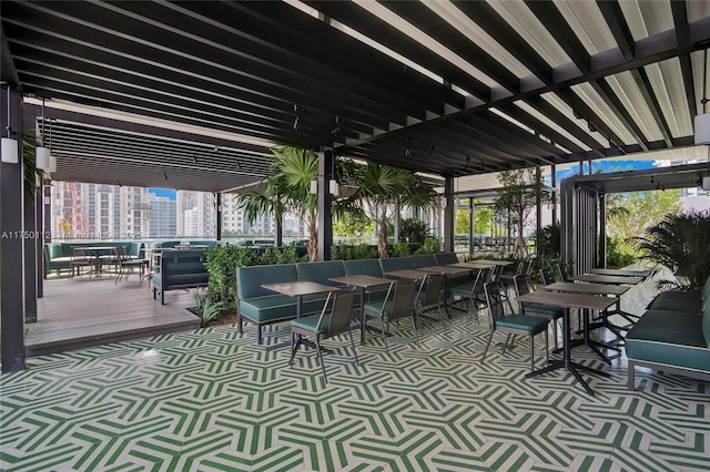 view of patio with a pergola and a city view