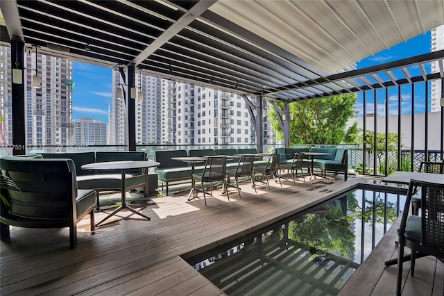 deck featuring a pergola and a city view