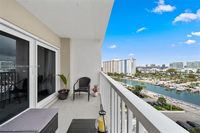 balcony with a view of city and a water view