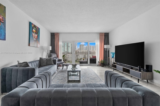 living room featuring light tile patterned floors and a textured ceiling