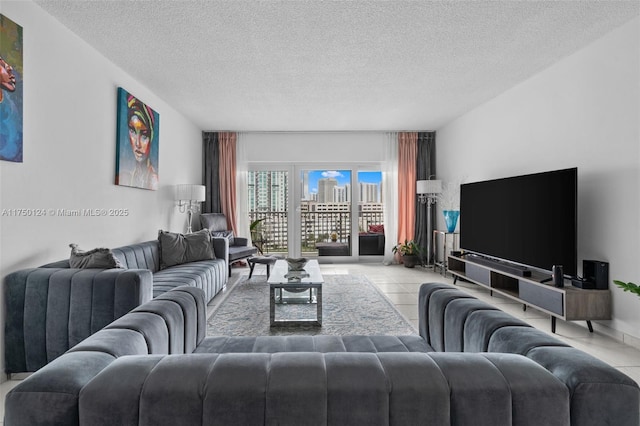 300 Bayview Dr Unit 807, Sunny Isles Beach, FL 33160 - living area featuring a textured ceiling and tile patterned flooring