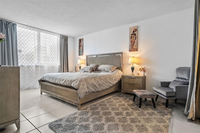 tiled bedroom with a textured ceiling